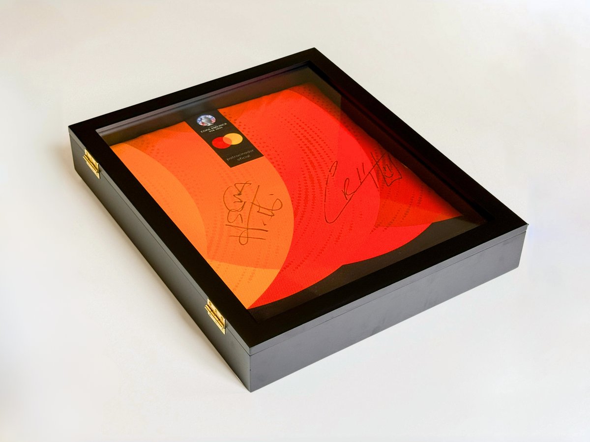 Image 2 shows the public relations frame outside of its packaging. The sleek black frame and reflective glass are emphasized.