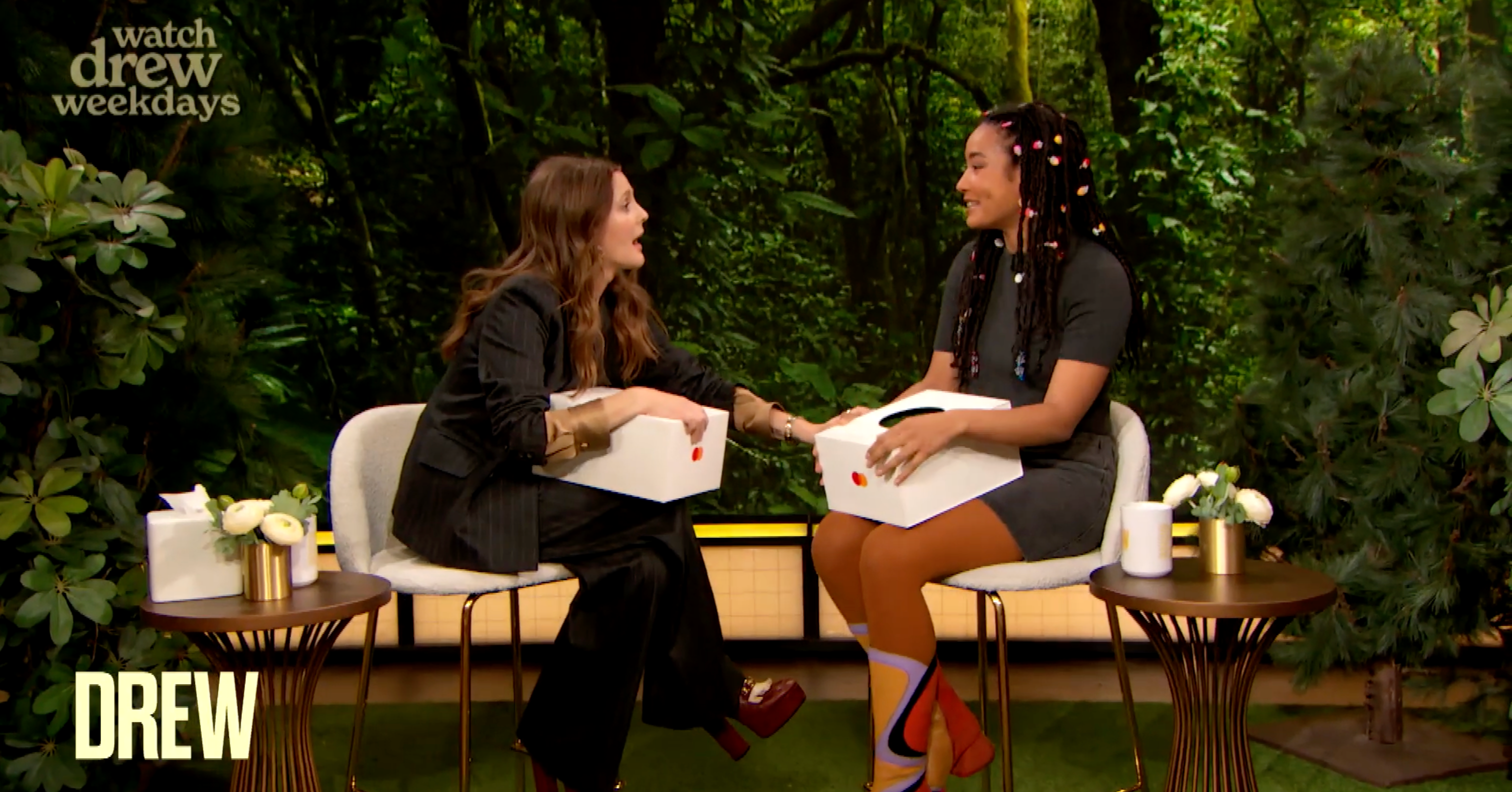 Still from the Drew Barrymore Show when SZA was opening her custom public relations box.
