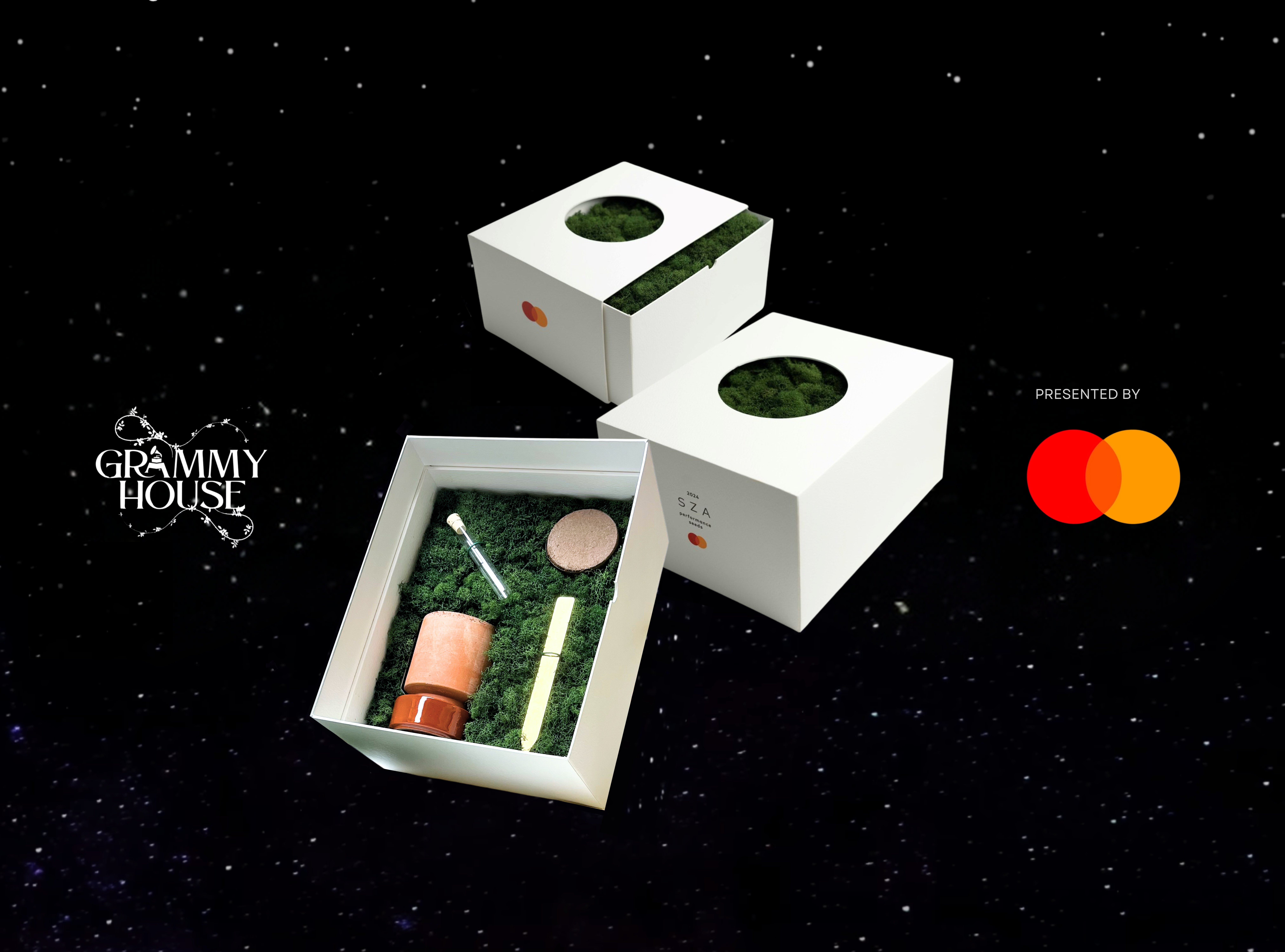 SZA x Mastercard influence box. Including a candle, wax seal stick, and fountain pen refill displayed on green moss inside of a white box.
