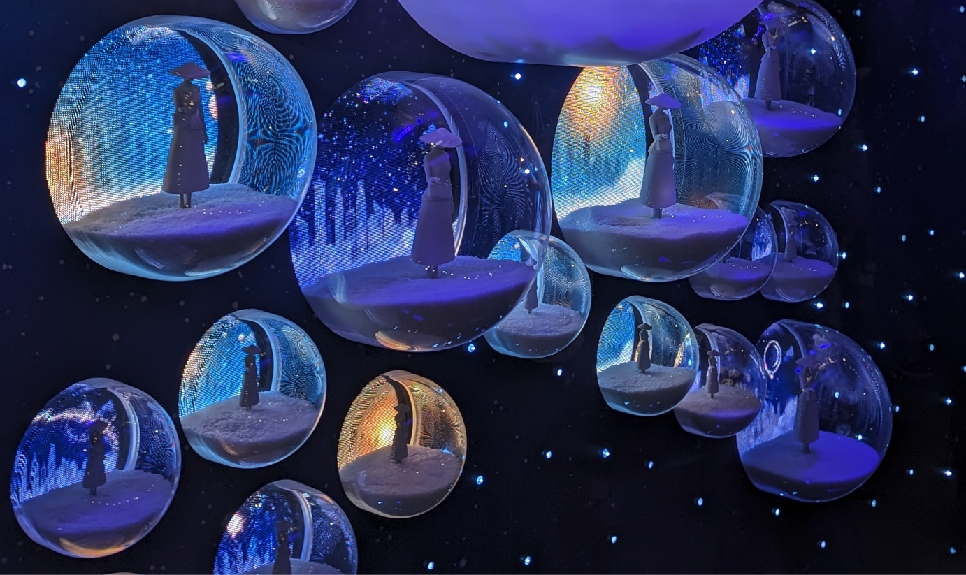 A close up of the spheres that created the start formation in the Dior retail Christmas window display. A singular 3D printed figure can be seen in each sphere.