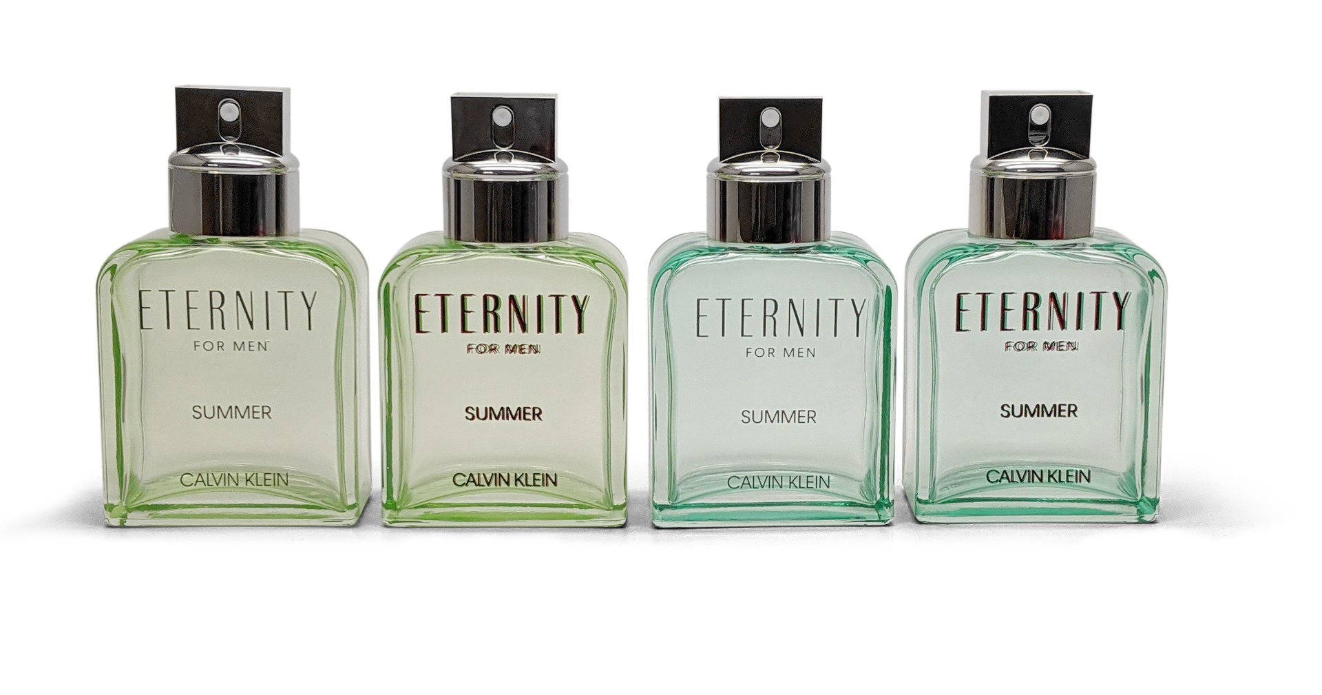 Calvin Klein perfume bottles. Different shades of light green glass bottles.