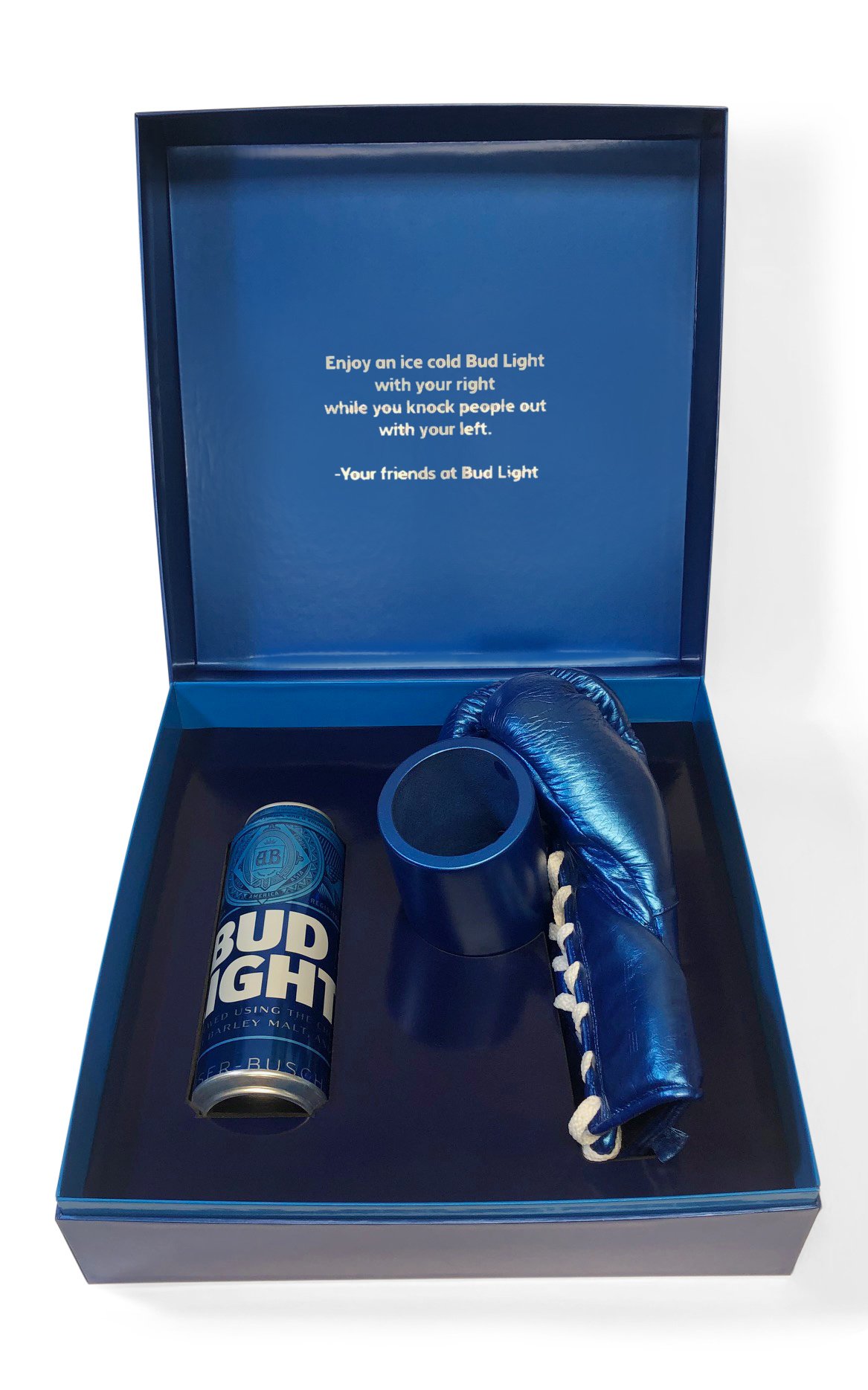 Influencer box created to promote Bud Light beer. The content is royal blue. A can of Bud Light beer and a boxing glove with a special attachment to hold the can of beer are included. The message "Enjoy an ice cold Bud Light with your right while you knock people out with your left" in shown on the lid.
